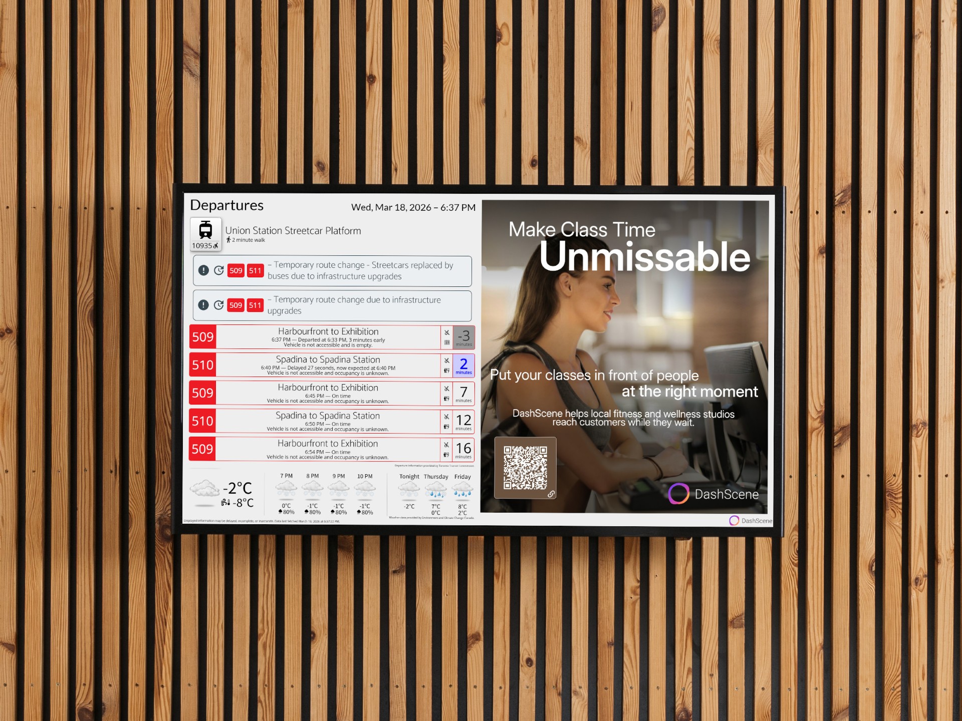 A DashScene display showing weather, and transit departures, with a gym themed DashScene advertisement of a woman standing at a reception desk.